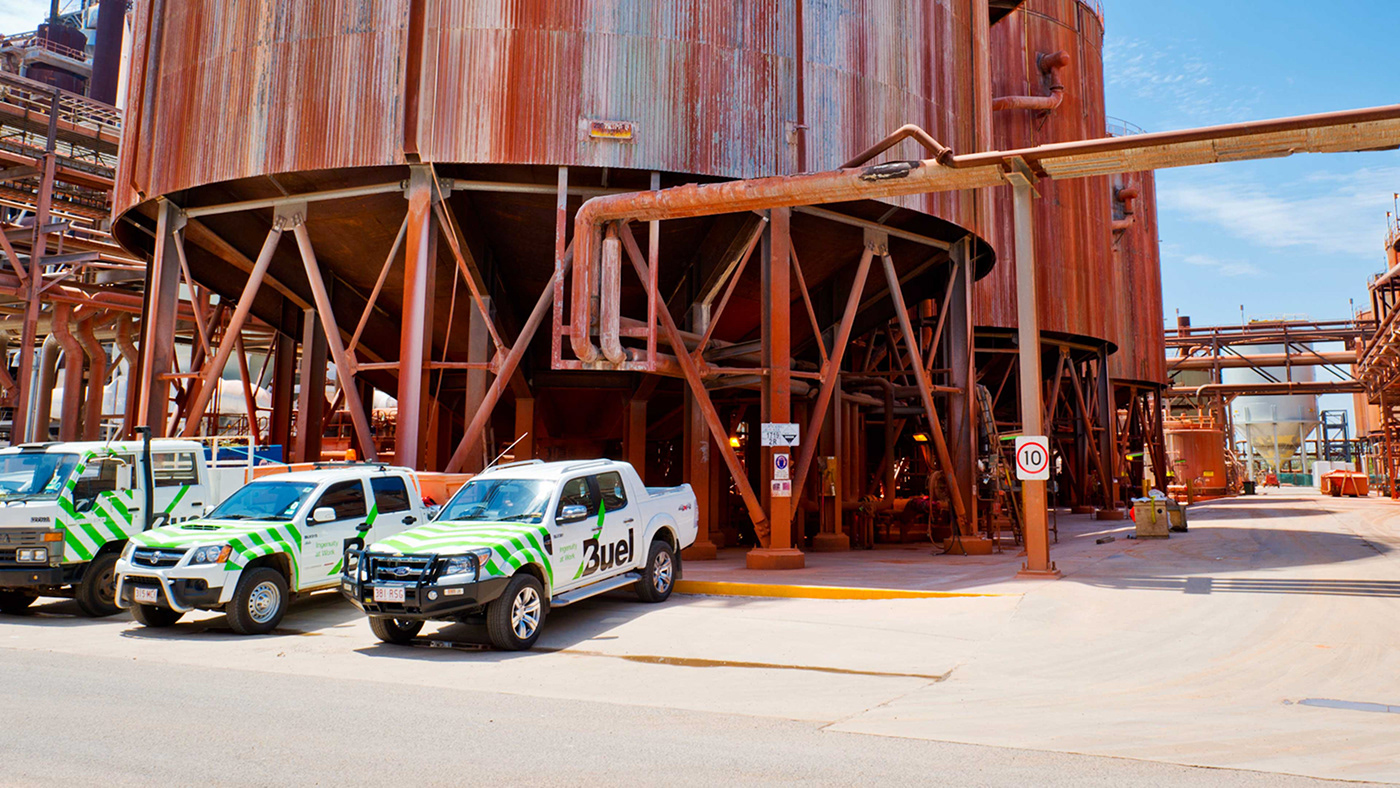 Buel - Brand identity mining services - vehicles parked at a mine