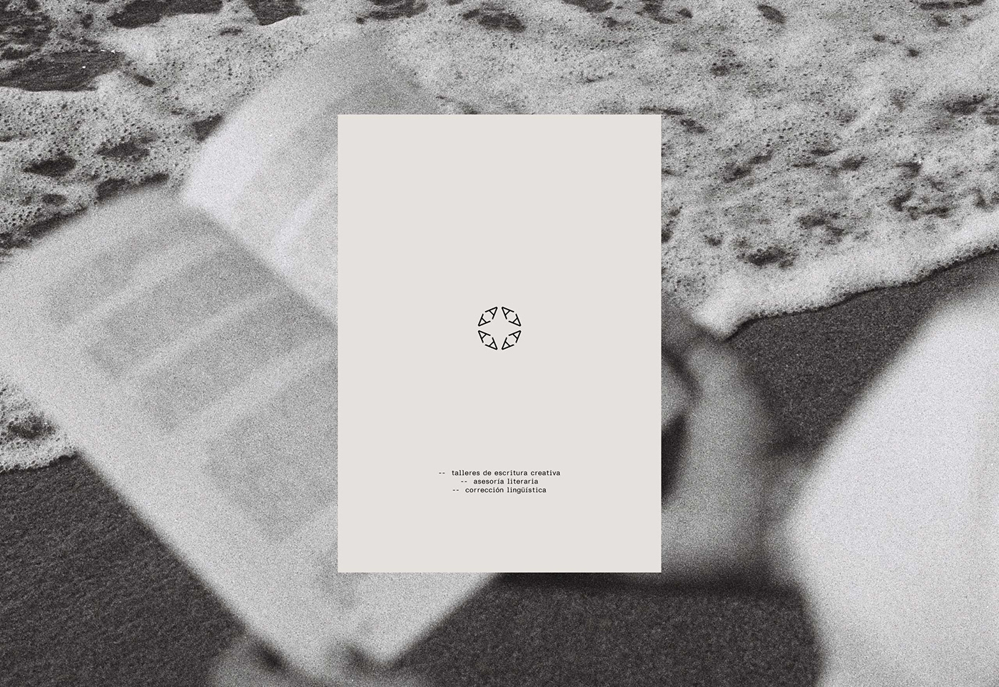Ana Haro's brand identity on a book against a sandy beach backdrop