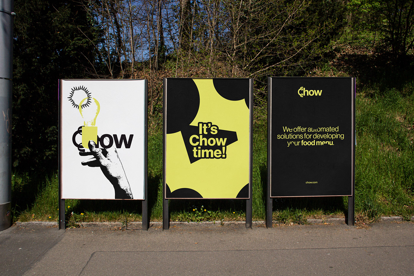 Three posters. One white, one yellow and one black.