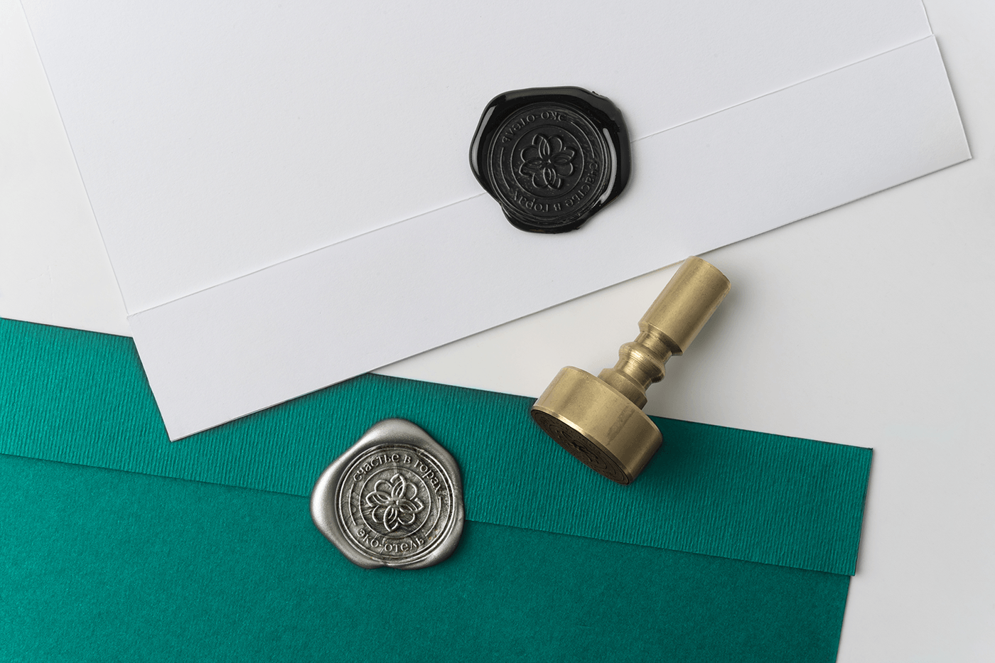 Design of a branded envelope made of premium cardboard, a stamp with a logo on a sealing wax seal
