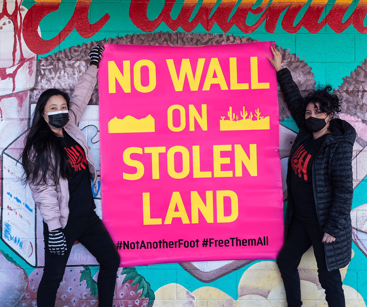 action activism banner colors No Border Wall
