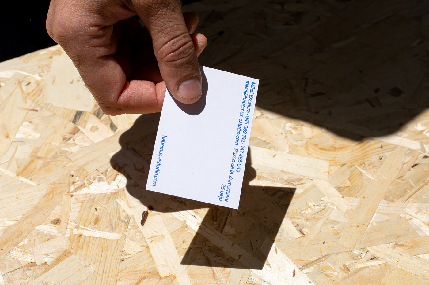 A member of the team handing a business card