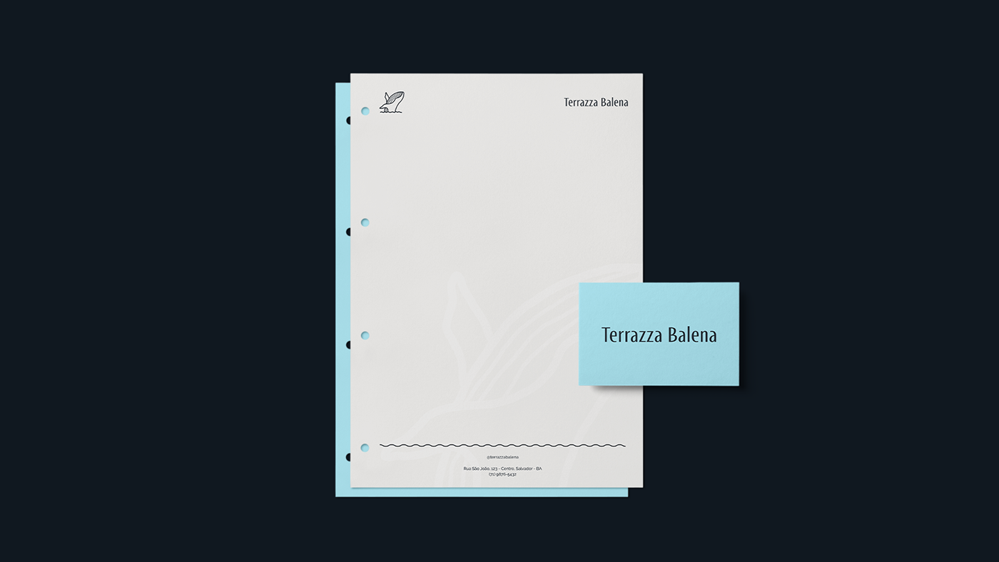 Letterhead and business card of 'Terrazza Balena' with whale logo, on dark background