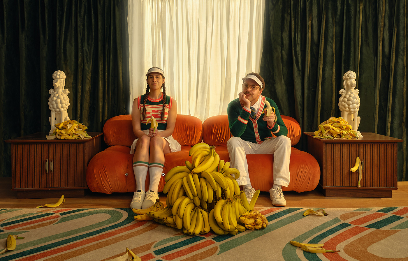 Bananas couple holiday card Mario Bellini Photography  portrait stylized surreal' Ted Lasso visor