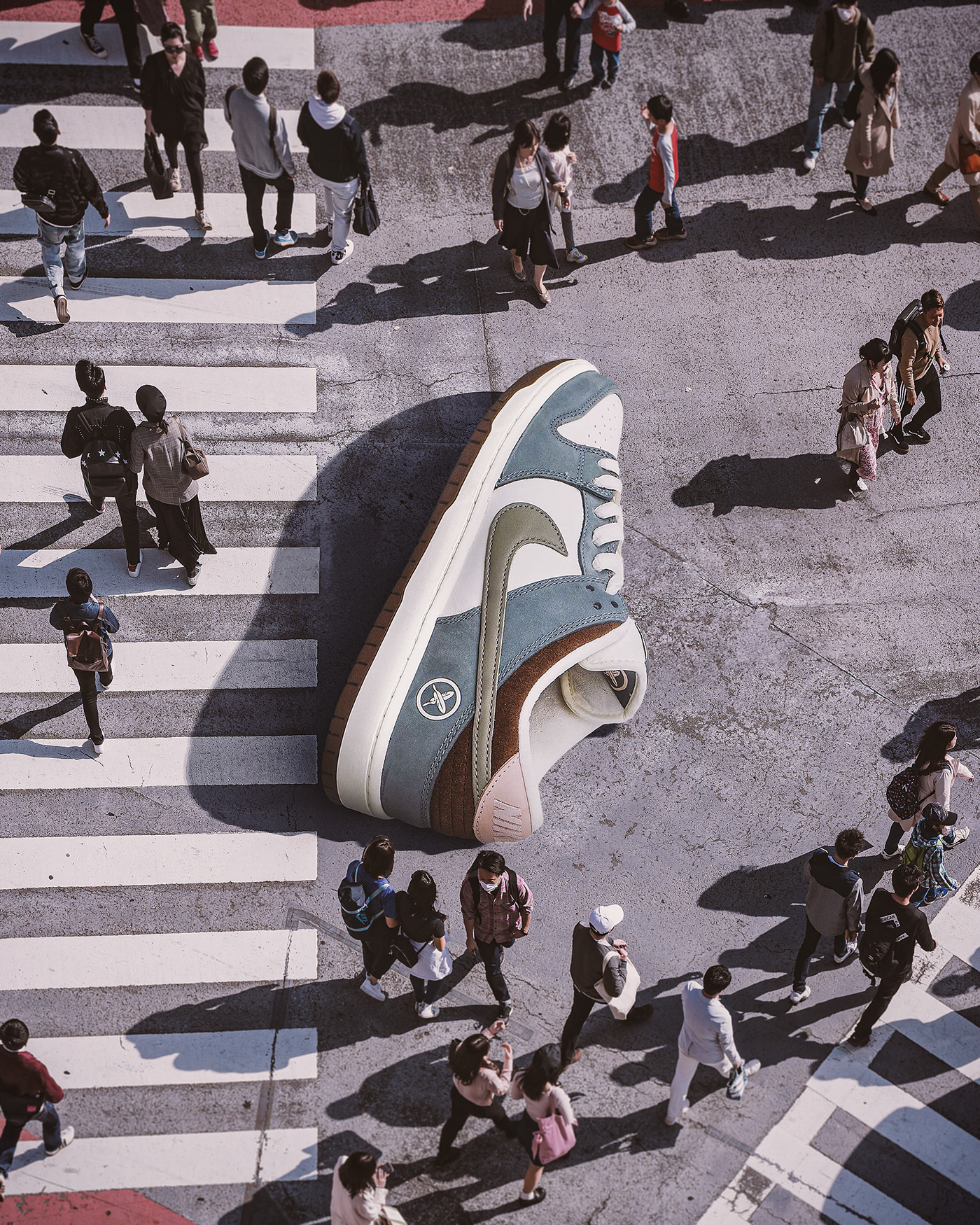 Photo composite of giant sneaker in the street . Retouching using Photoshop
