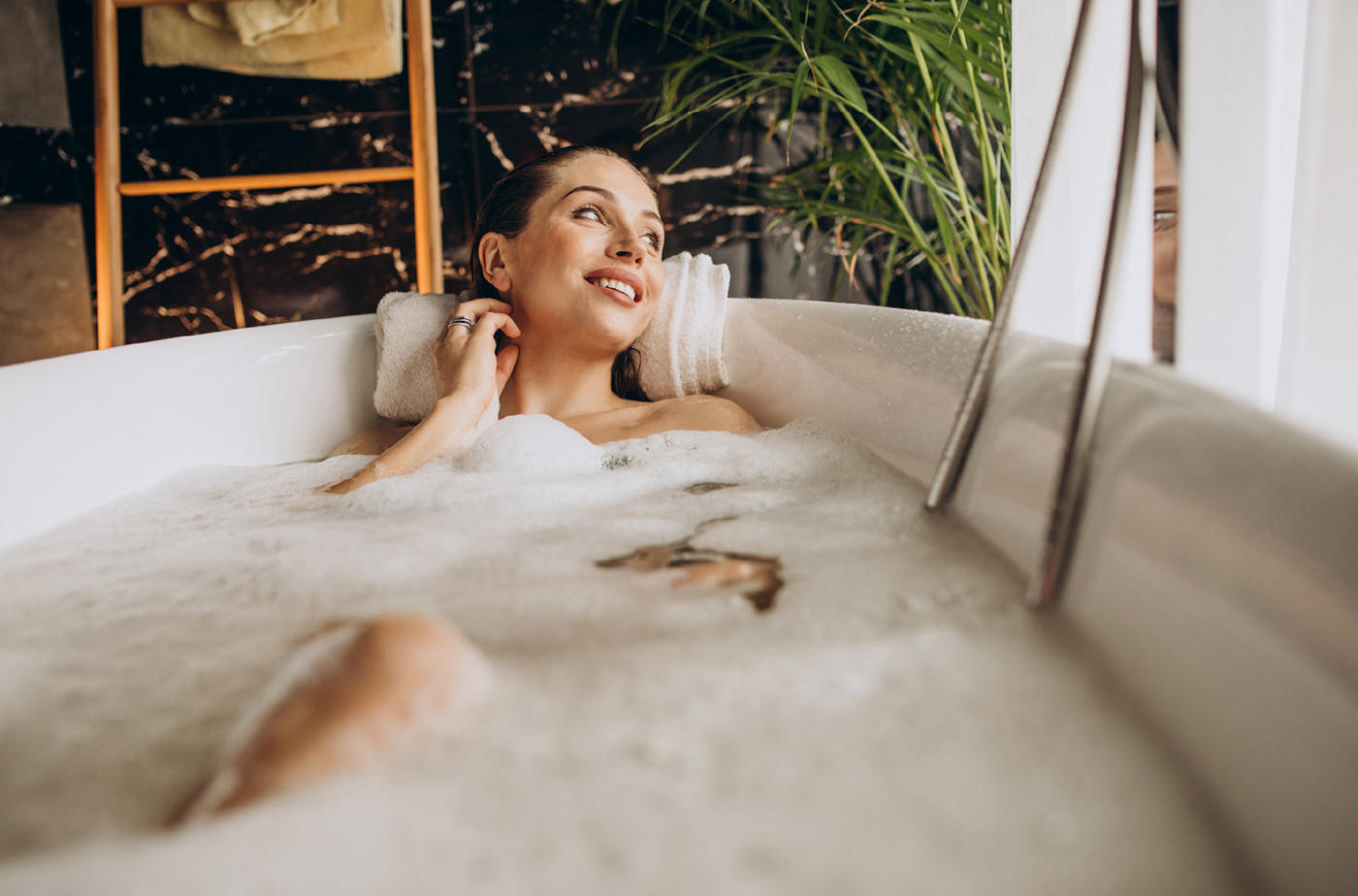 woman taking a bubble bath
