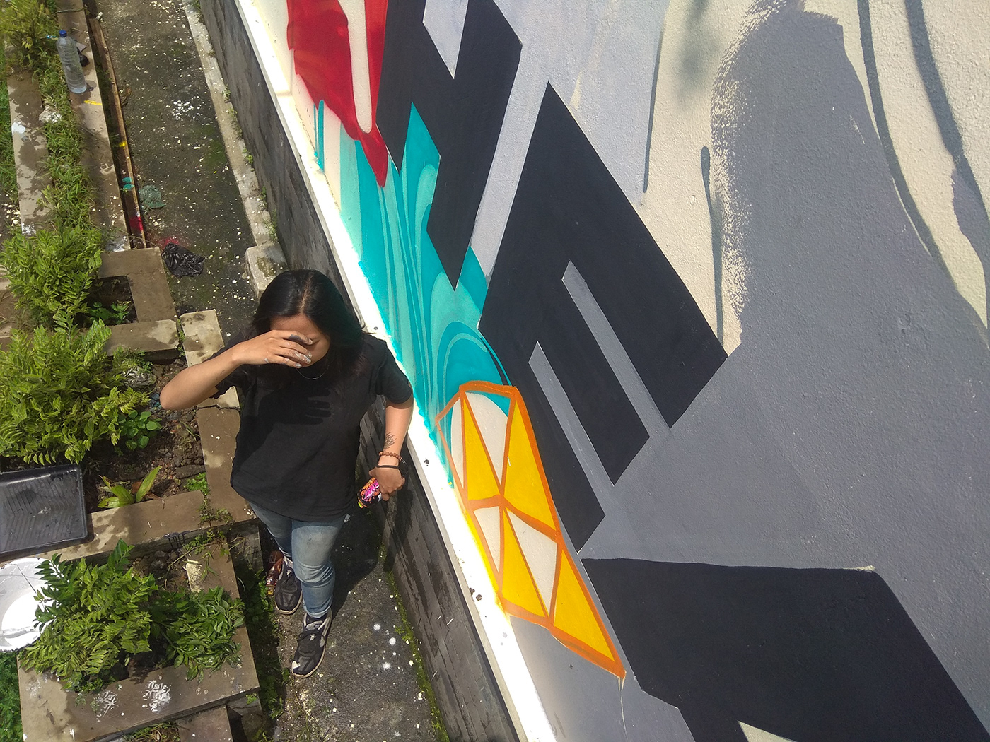 alodia yap x greg sidharta mural making on huge street art