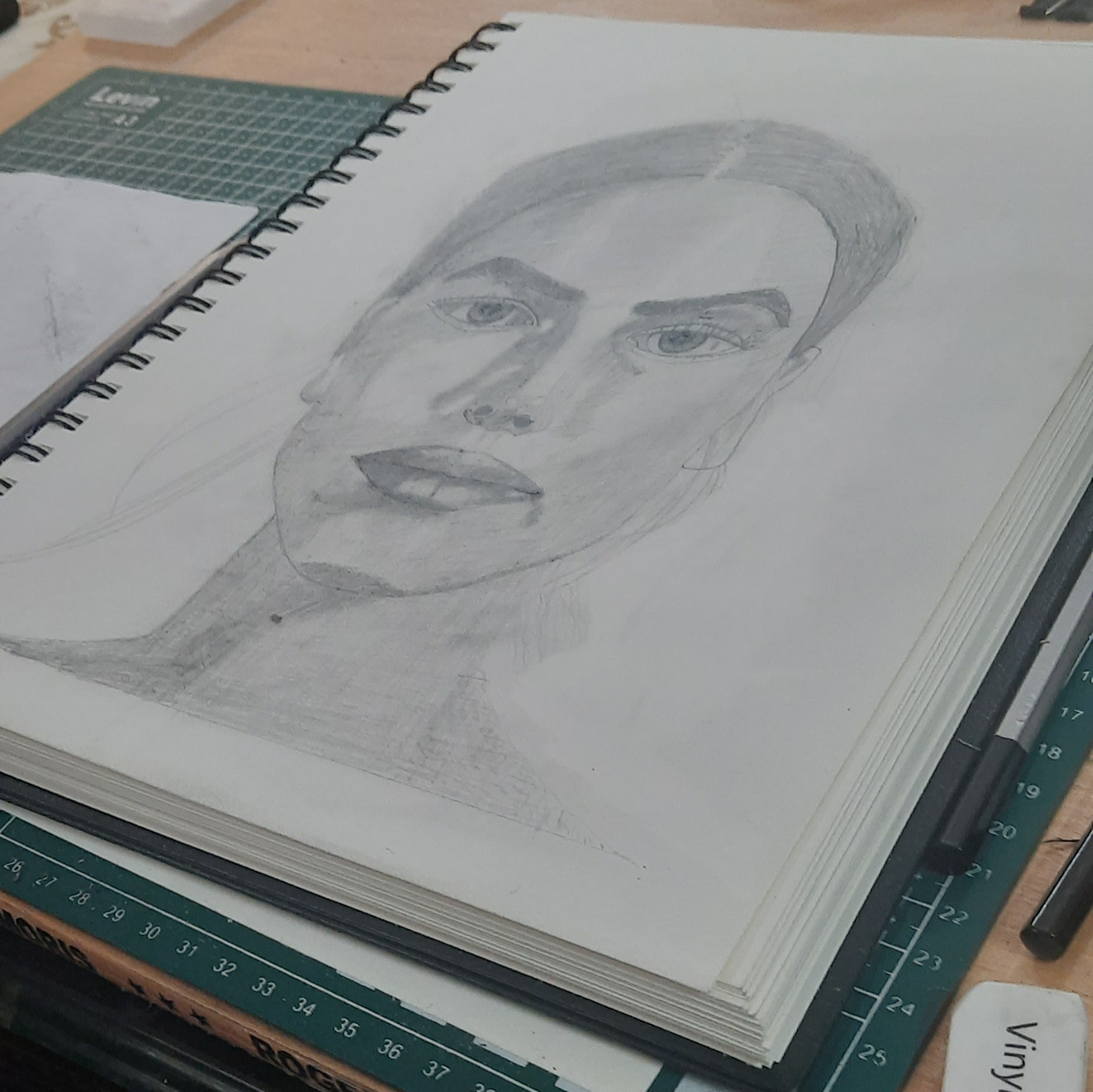portrait face pencil sketching sketchbook