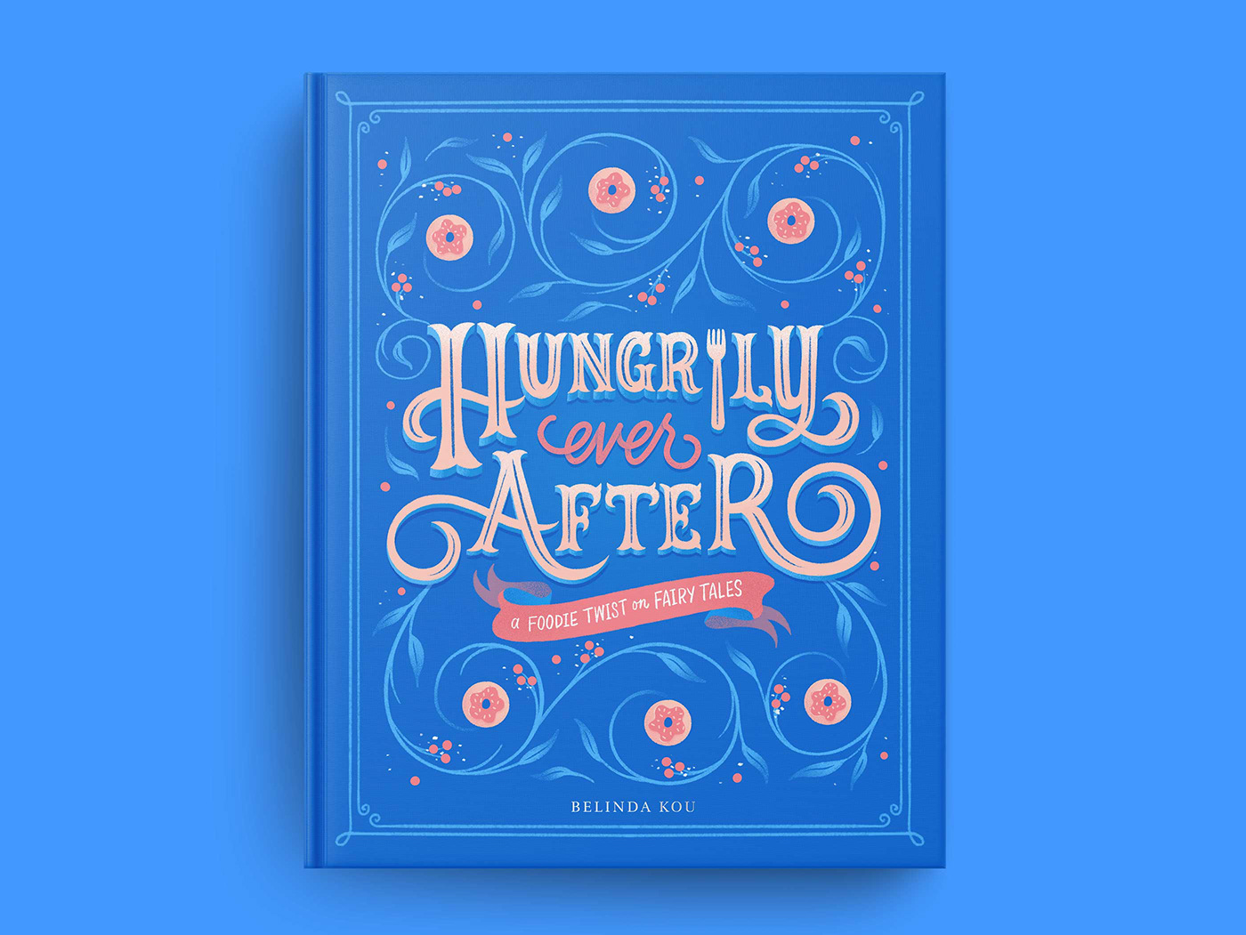 Book cover art featuring hand lettering and illustrations of fairy tale and food art