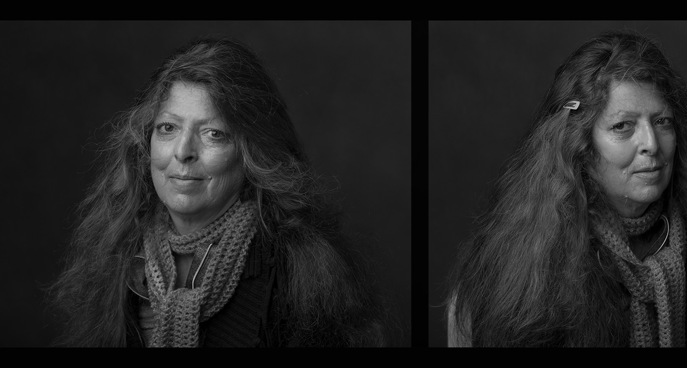 Beautiful Black and White Portrait of American homeless woman with long hair wearing scarf. 