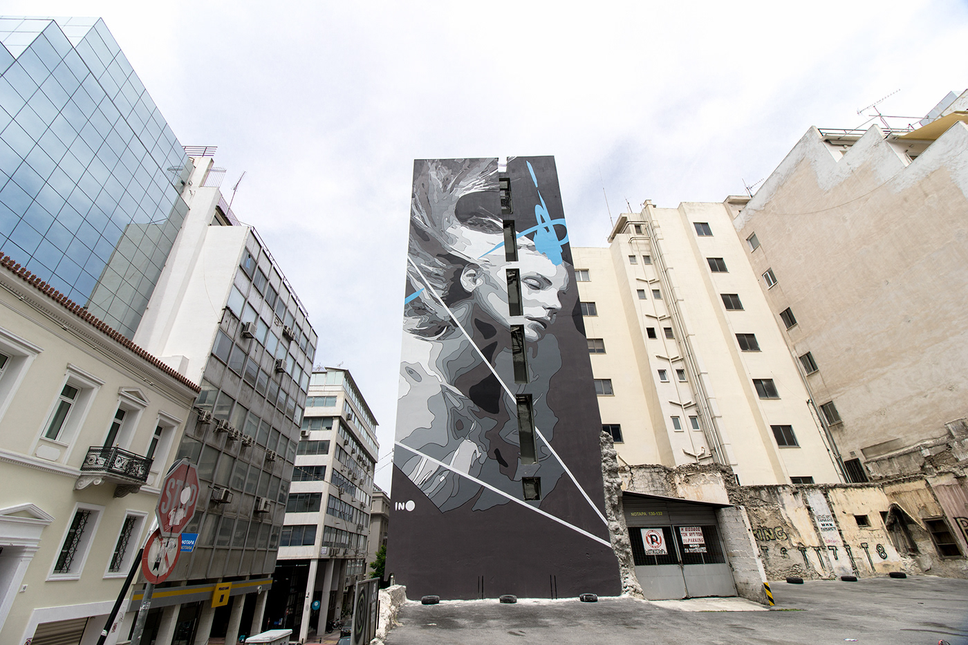Ino artist contemporary public Urban Street building woman blue cityscape