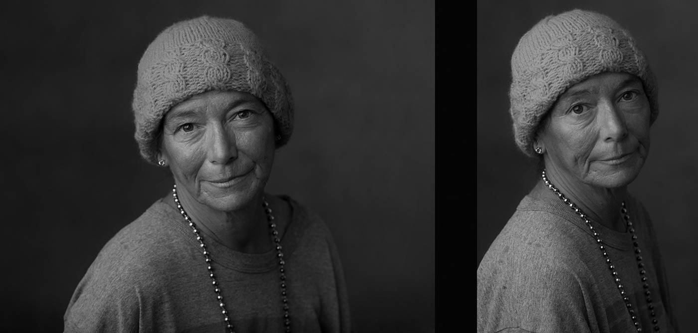 Beautiful Black and White Portrait of American homeless woman wearing Stocking cap beaded necklace.