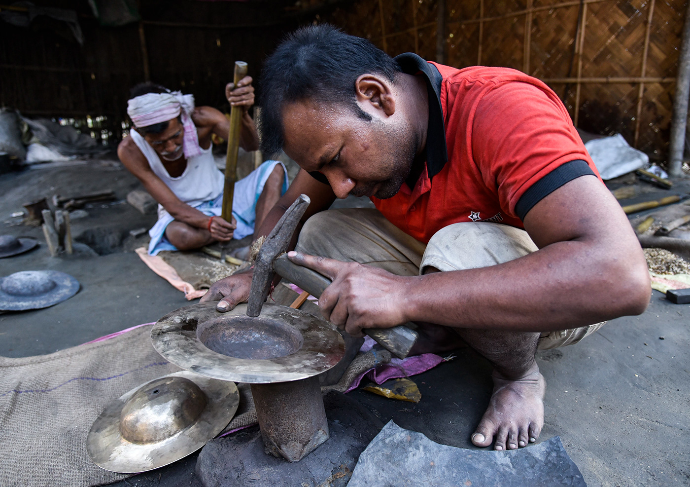 Bell metal people worker Workshop India assam handicraft