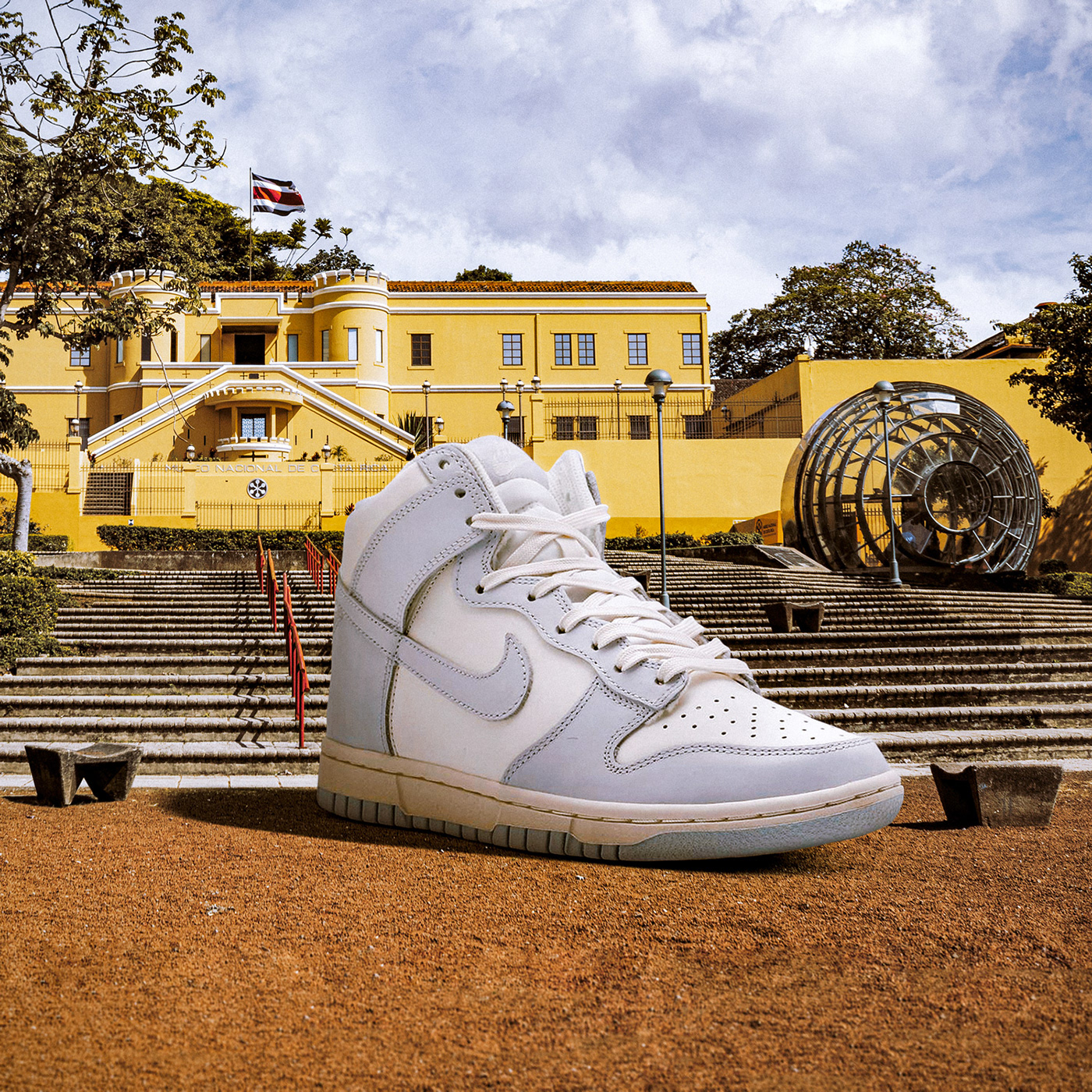 Photo composite of giant sneaker in nature. Retouching using Photoshop
