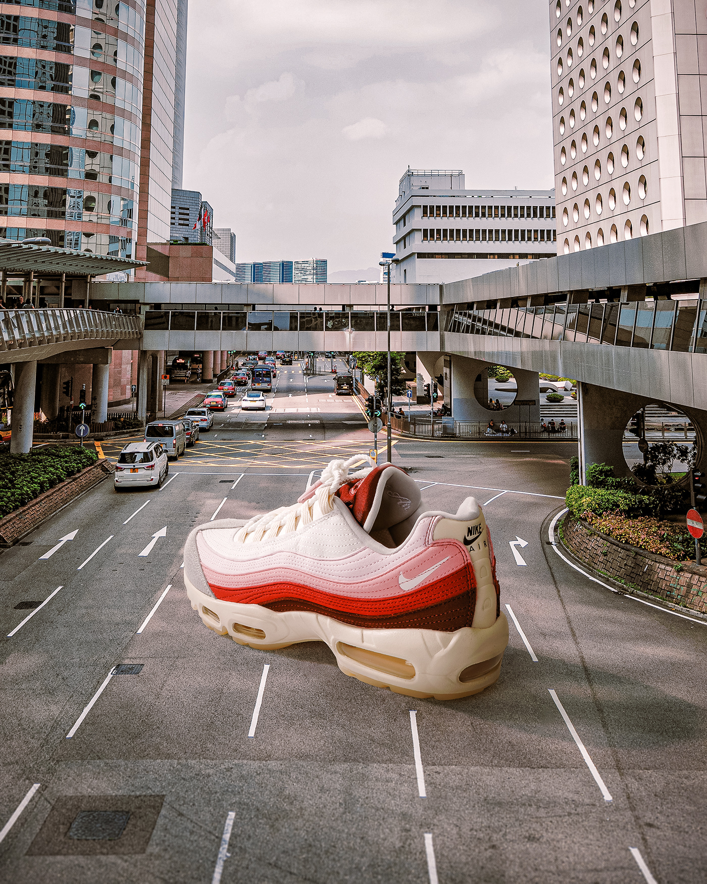 Photo composite of giant sneaker in the street. Retouching using Photoshop