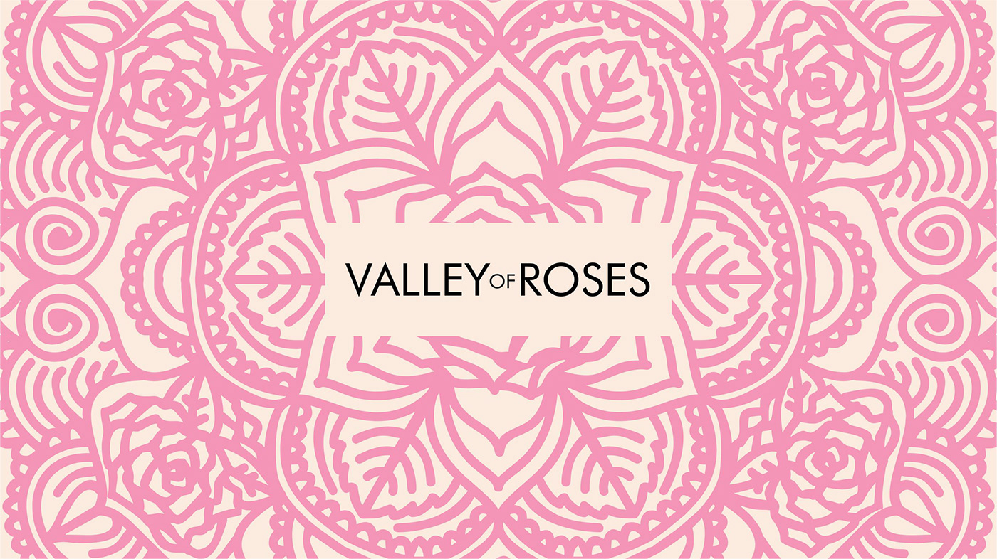 Pink ornamental illustration for "Valley of Roses", featuring roses