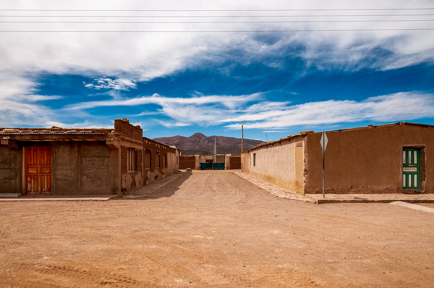 Street photography of a small village in the bolivian altiplano by photographer Jennifer Esseiva.