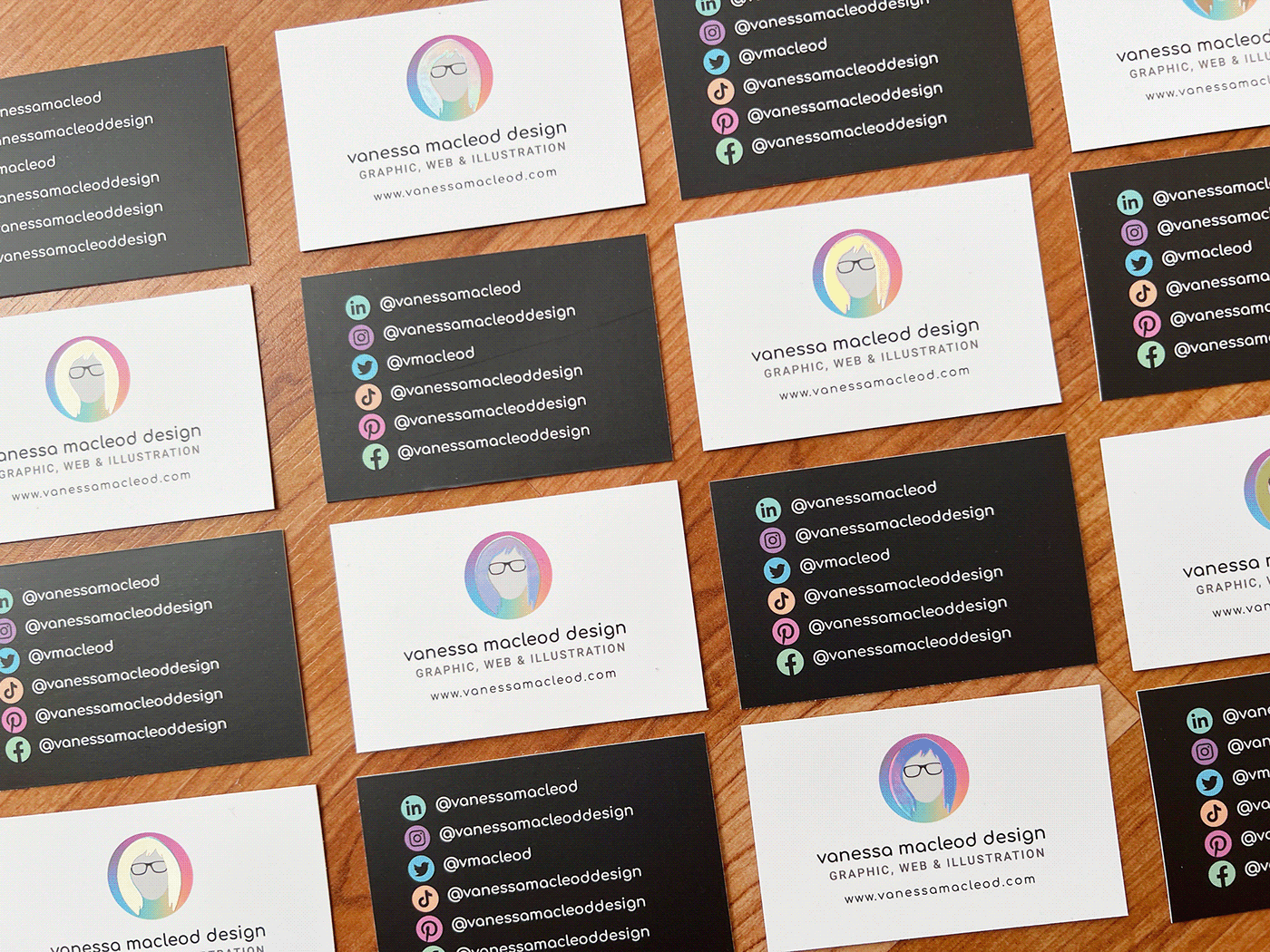business cards laid out to show front and back design