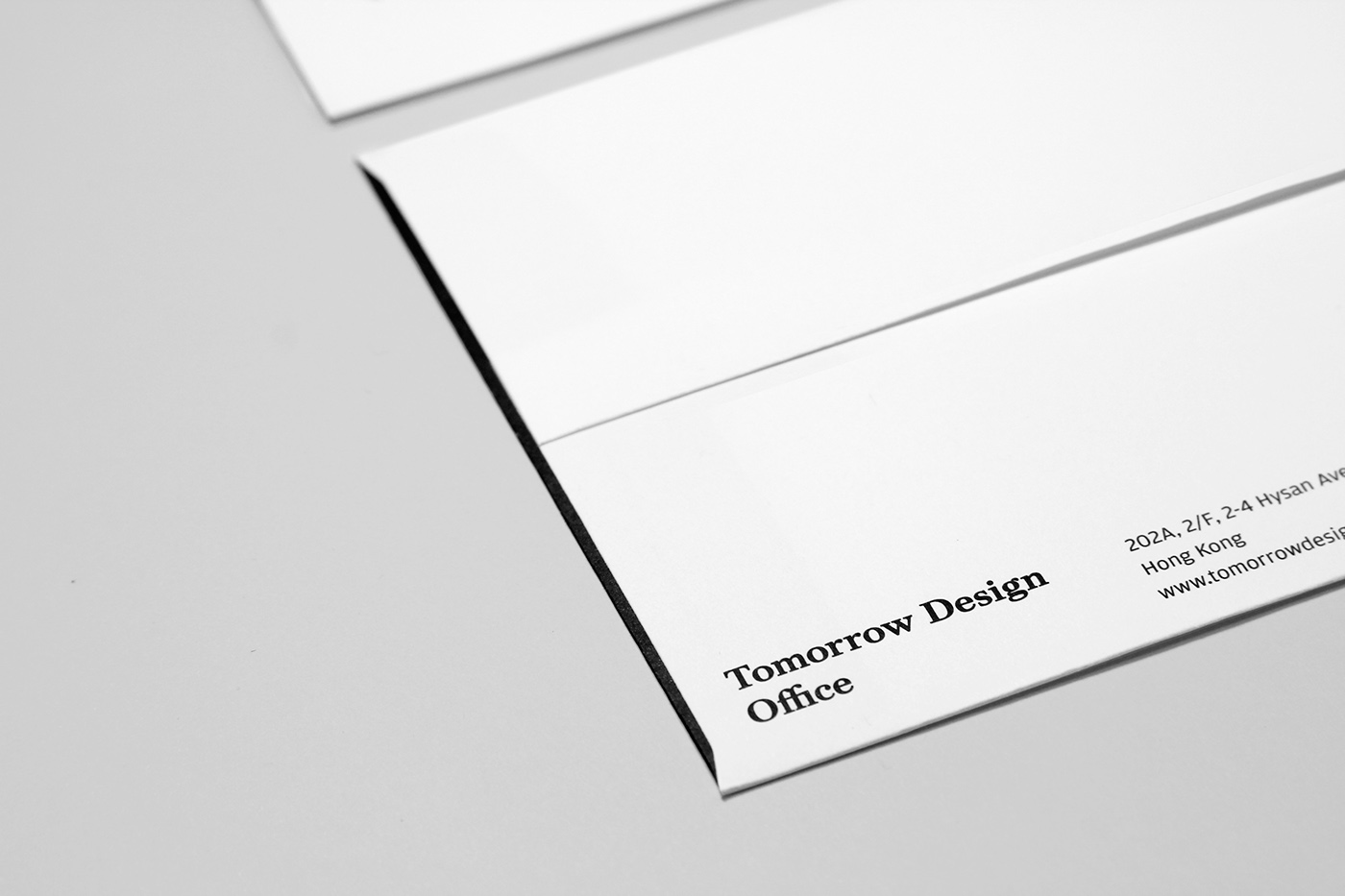 Name card visual identity branding  Stationery envelope logo bilingual monotone minimalist graphic design 