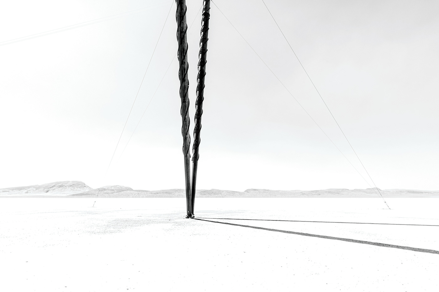 black and white desert dirt Dry Lake Bed dust Isolated Landscape monochrome nevada power lines power poles remote rural sand Stark wind