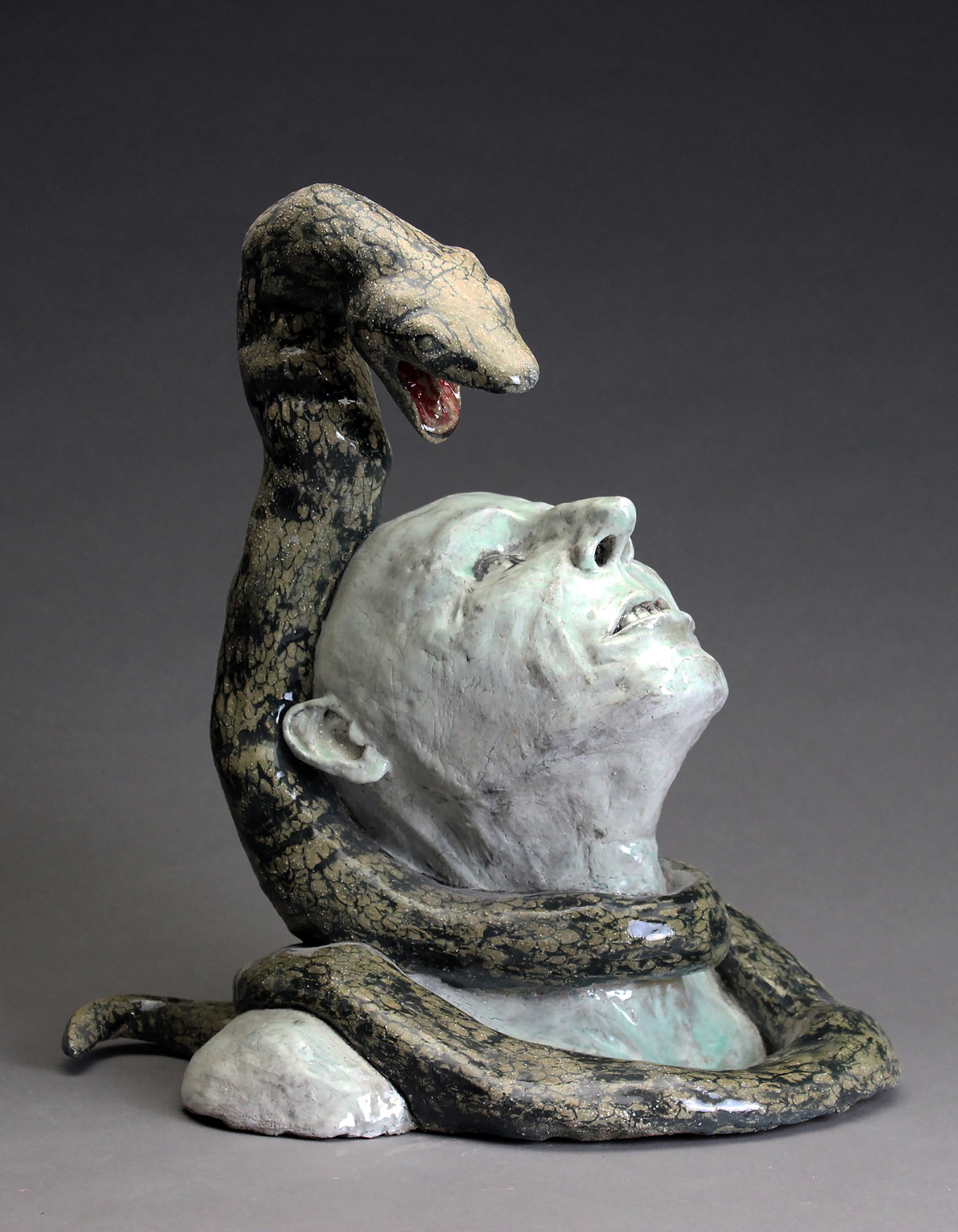 ceramic sculpture snakes skulls