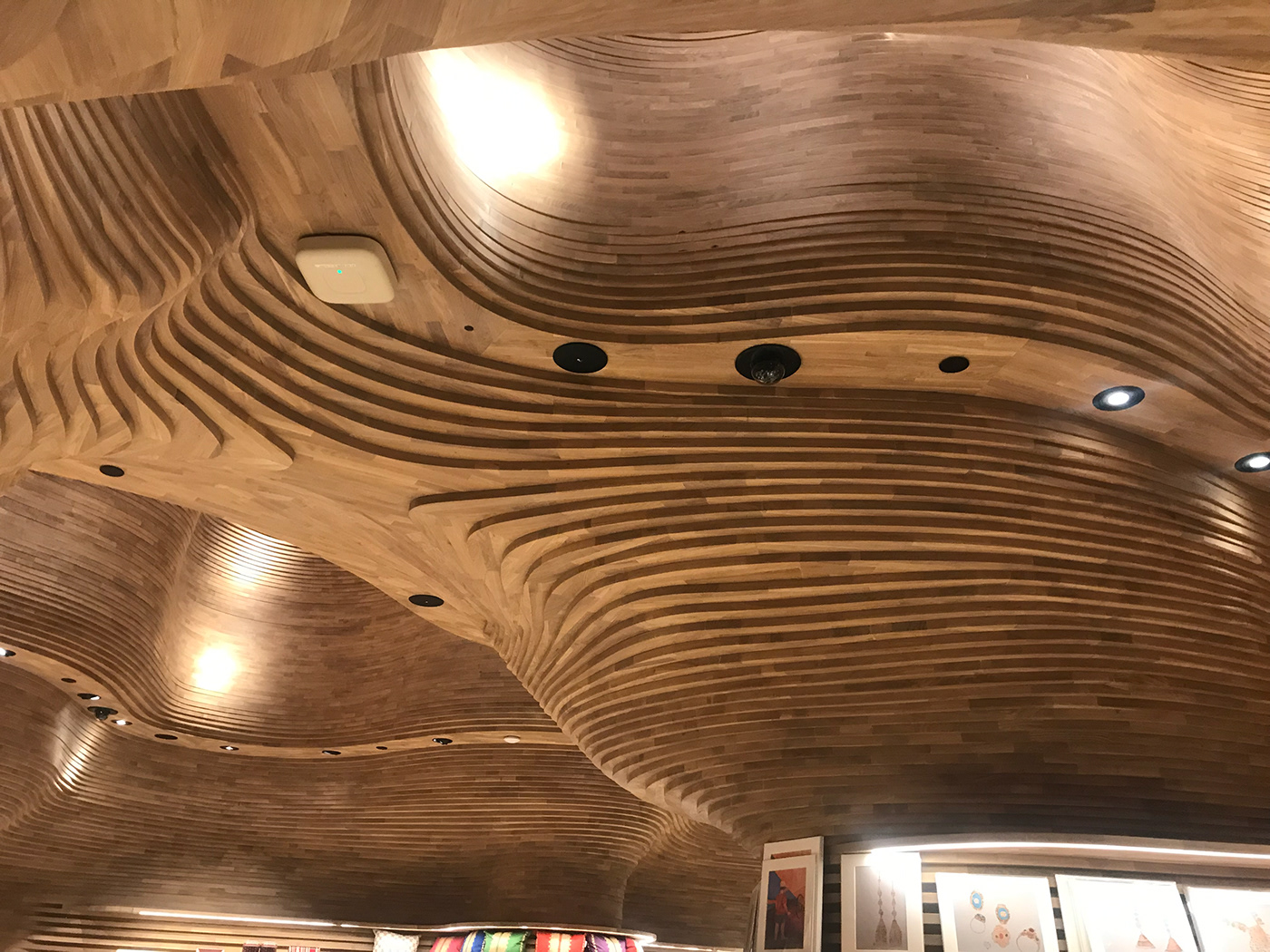undulating wooden Surfaces cave interior design  qatar national museum koichi takada gift Shops parametric
