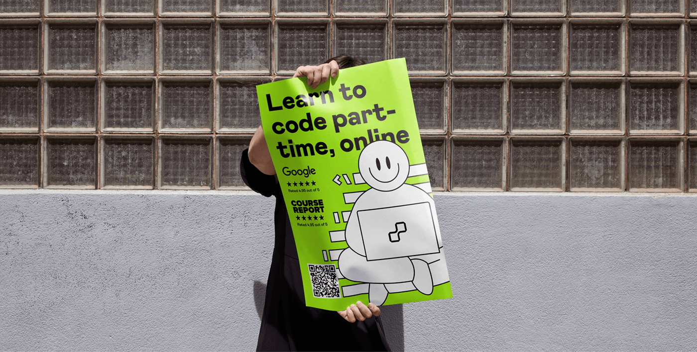 A person is holding a printed poster advertising the coding school