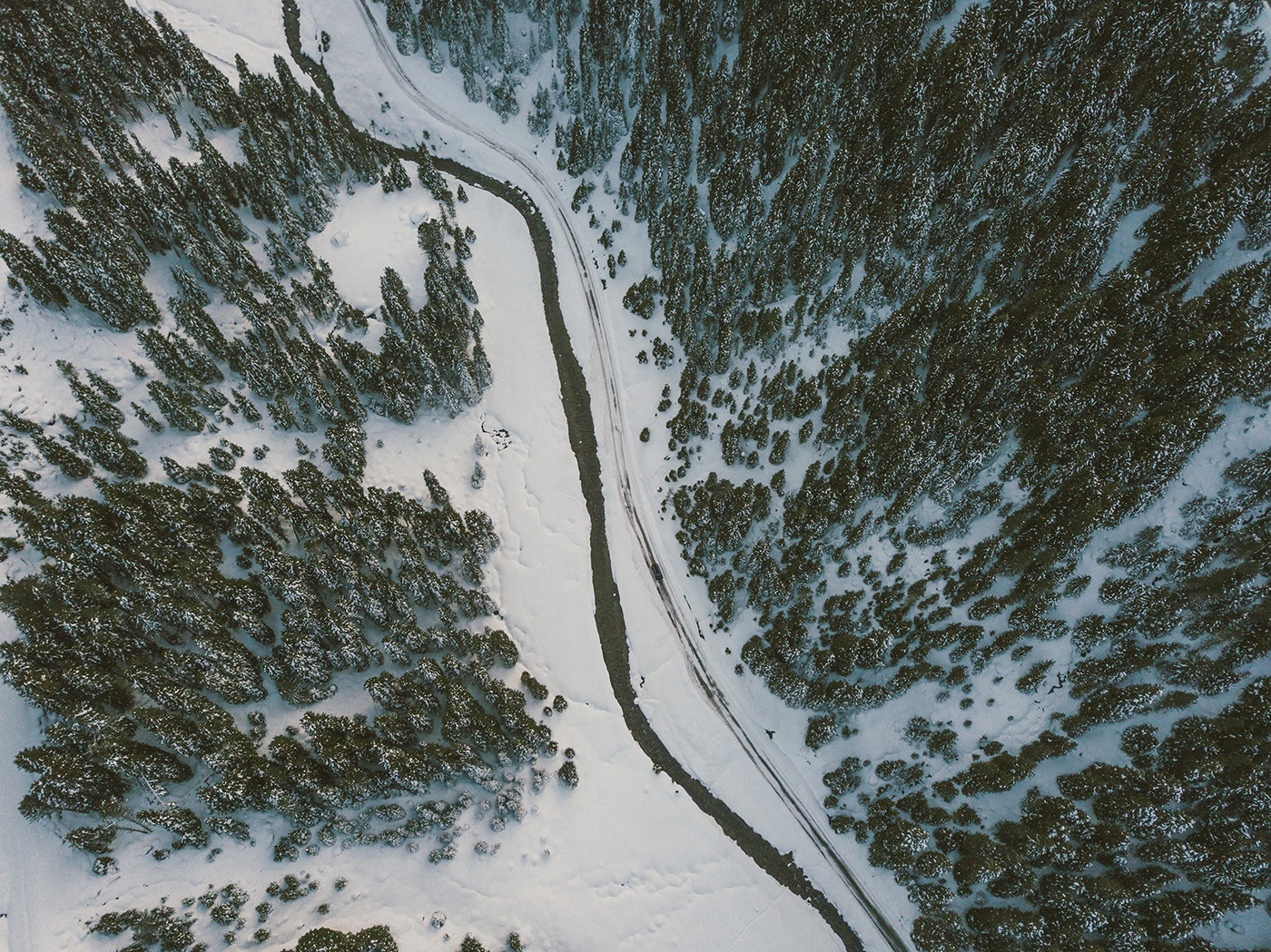 drone-car-street-trees-snow