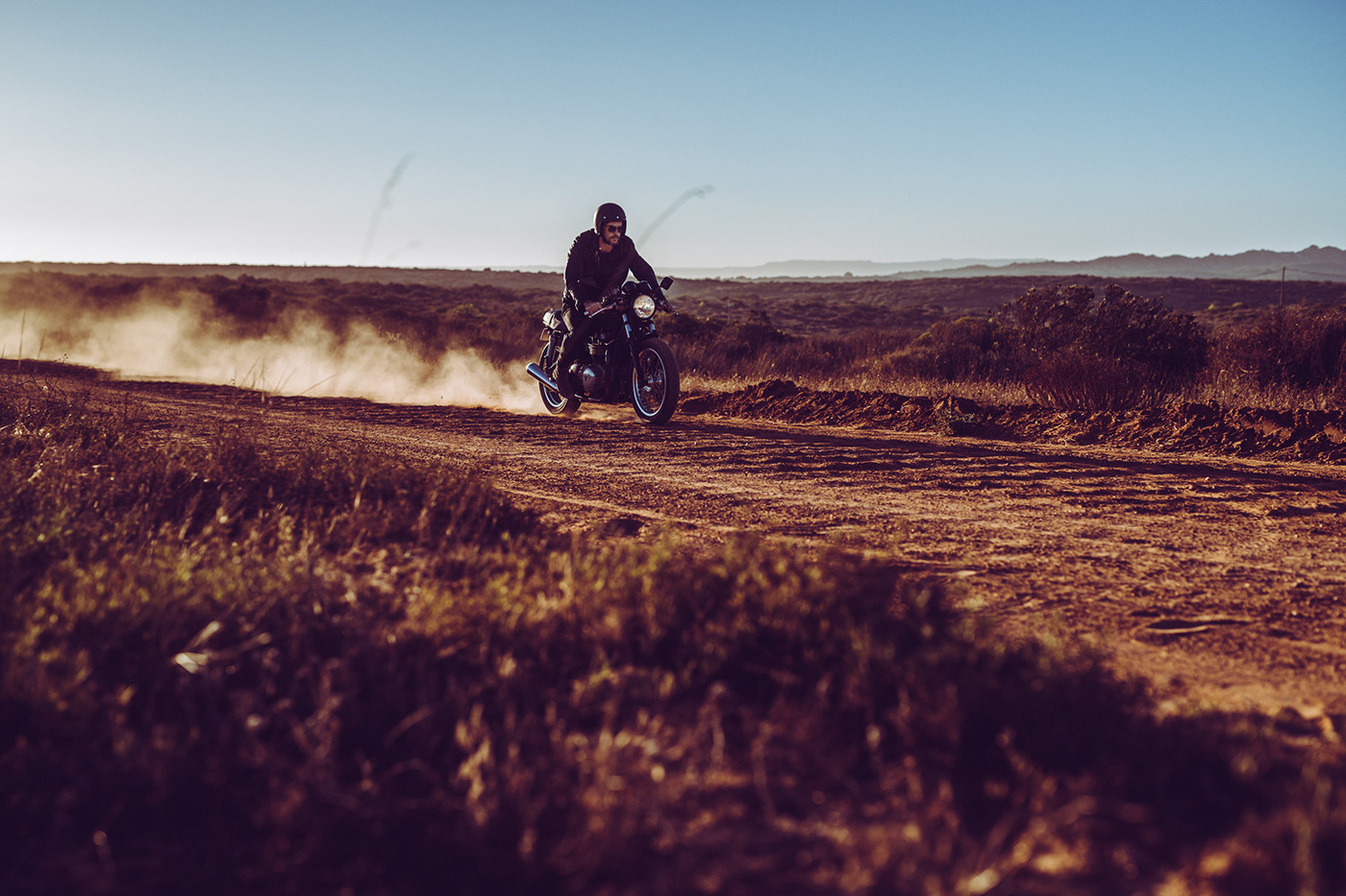 triumph motorbike rider Into the sun Landscape
