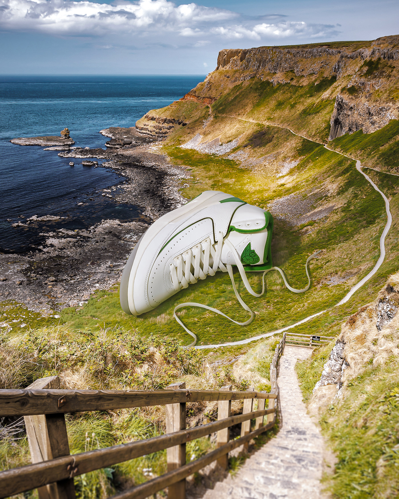 Giant sneaker photo composite next to the sea . Retouching using Photoshop