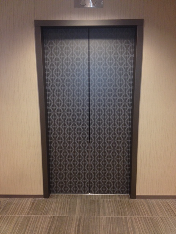 digital film large format printing environmental graphics wallpaper digital design large scale ink jet financial residential elevator door Custom Interior Graphics Hospitality Lobby