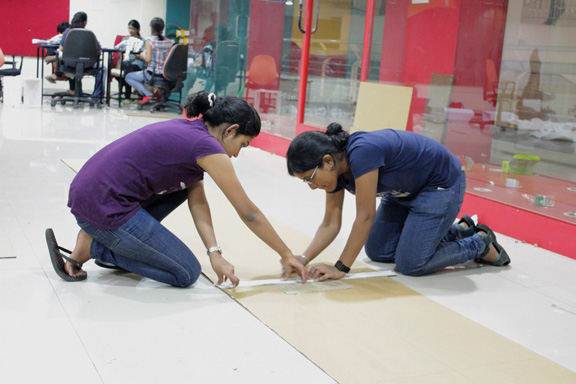 store cardboard college festival student group elephant exhibit product sale corrugated company roof canopy grid