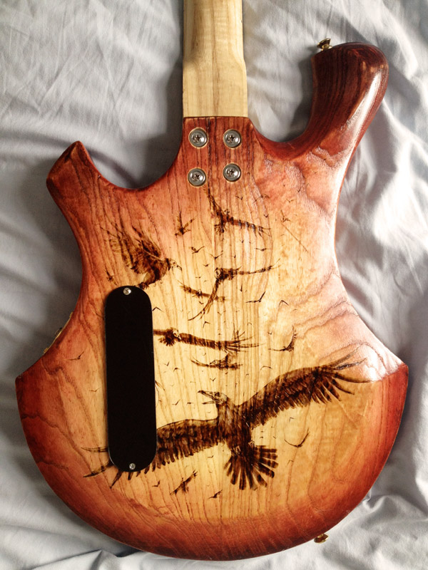 pyrography  woodburning  bass guitar  electric bass  crows  custom instrument  feathers