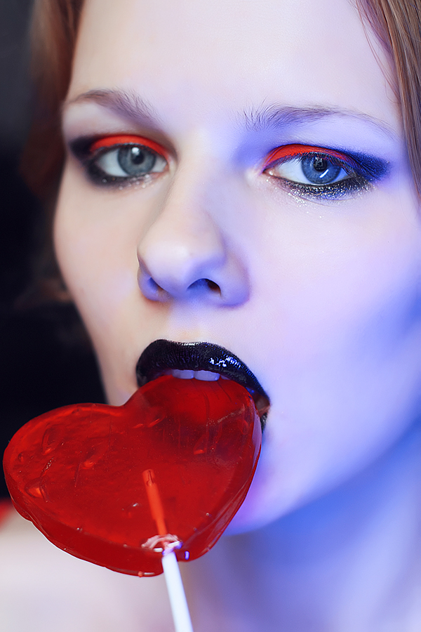 Candy lollipop heart heart shaped lollipop black lips red eyeshadow suck lick Valentine's Day red close up portrait face