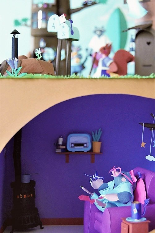 The paper artist mole inside his den and the entrance to it. 3D handmade work. Vignette from diorama