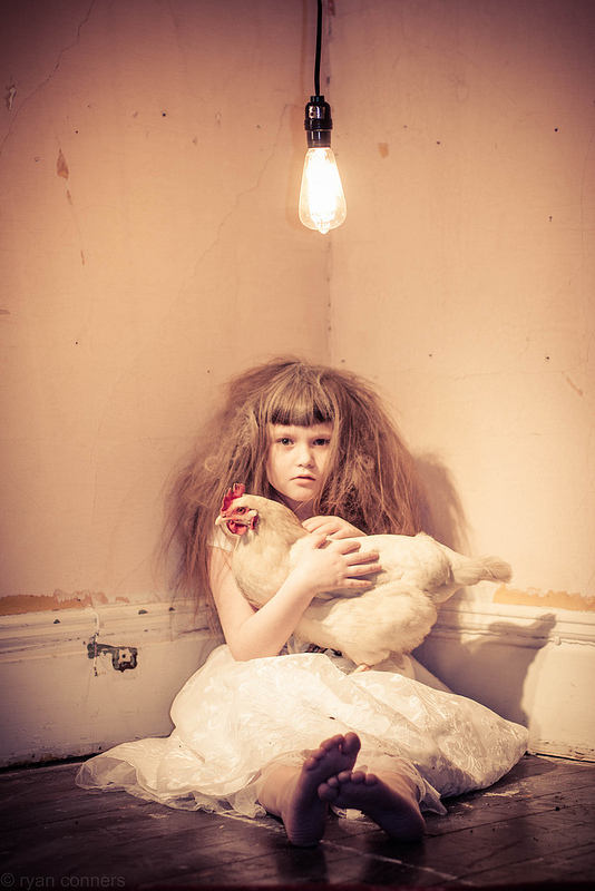 child  girl chicken Pet bird gritty decrepit room light