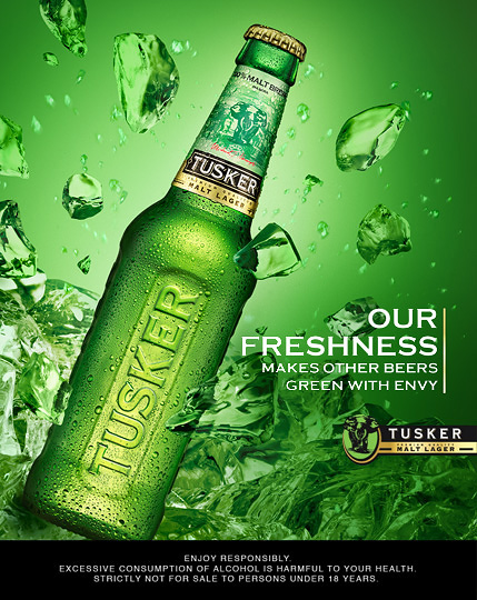 beer Tusker malt lager splash light green bottle water ice drink Still glass flare postproduction