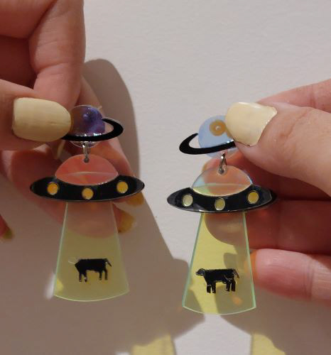 Cow getting taken by a UFO earrings