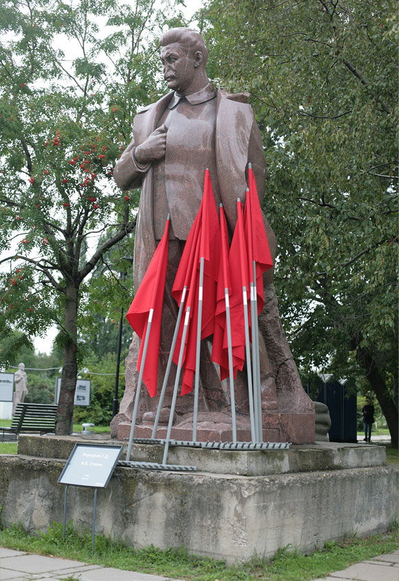 flags rakes & statue of Stalin.