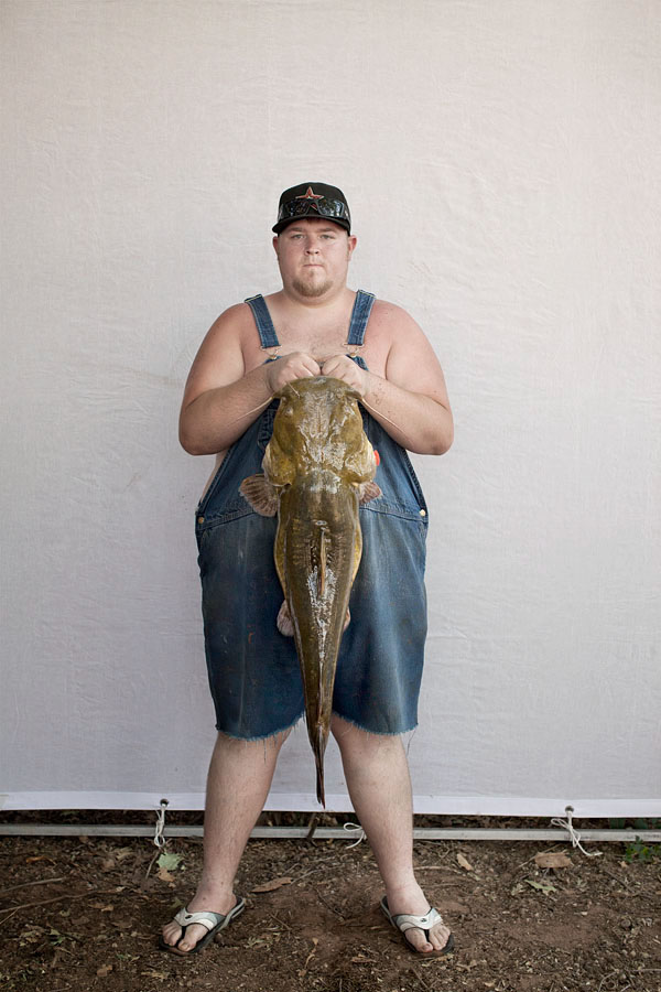 catfish  noodling  oklahoma fishing strange portrait editorial