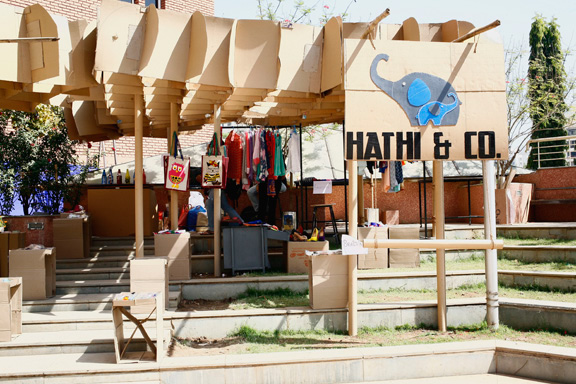 store cardboard college festival student group elephant exhibit product sale corrugated company roof canopy grid