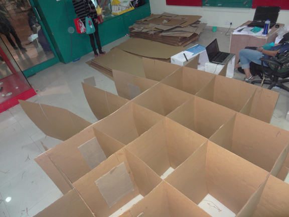 store cardboard college festival student group elephant exhibit product sale corrugated company roof canopy grid