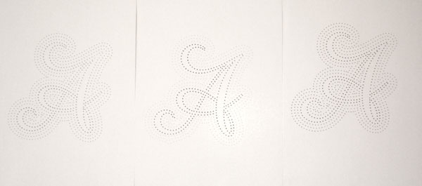 Script  letter a  letter typo  typography holes pierced cardboard paper alphabet punched Hilka Riba