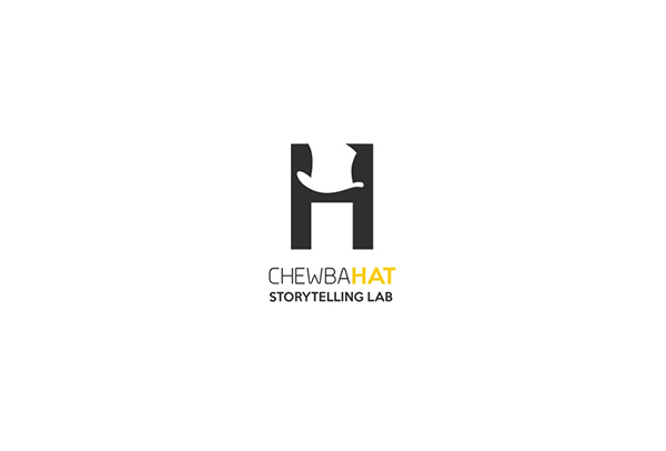 chewbaha storytelling laboratory yellow hat negative spaces White clean letter