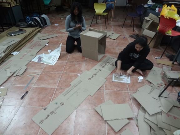 store cardboard college festival student group elephant exhibit product sale corrugated company roof canopy grid