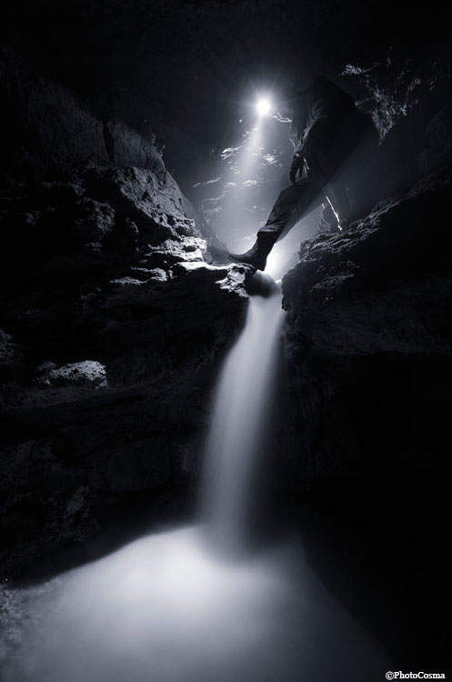 cave dark eerie limestone man Speleology Caving light underground explore romania