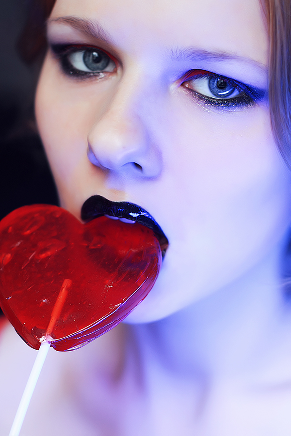 Candy lollipop heart heart shaped lollipop black lips red eyeshadow suck lick Valentine's Day red close up portrait face