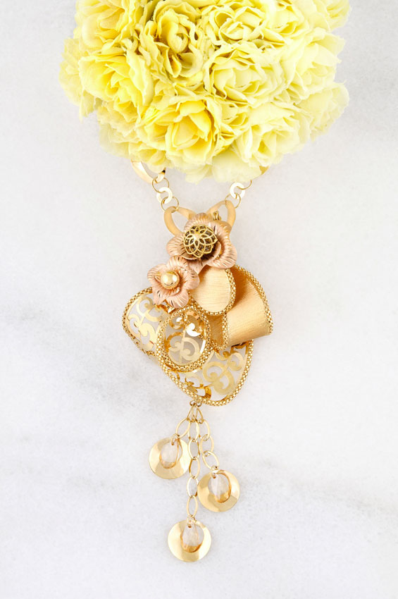 L'AZORDE Ali Omar gold model jewelry flower