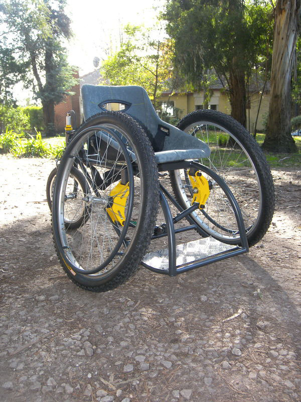 This product is designed to meet the travel needs of a person with reduced motor skills in the lower limbs. The disabled is today with many barriers in society being limited in sport the high cost of special wheelchairs. What is sought is to make a product that can compete with wheelchairs that are in the market today in terms of costs and benefits. It combines the qualities of a common wheelchair a chair with the sport giving users certainty about the rigidity of the structure a third point of support provided by the rear wheel and a comfort in the displacement that gives the suspension system and road of 26 ¨ front wheels. It has a suspension system that adapts to the weight of the user and a regulator of camber in the front wheels. The armchair is constructed as a fiberglass monocoque with a upholstery designed to give comfort and a better position to user also has an adjustable belt.