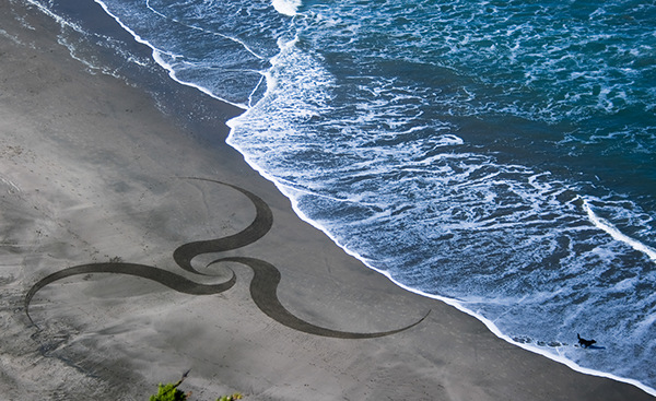Beach art rake art earthscape art sand art largescale art Adobe Remix Logo Remix